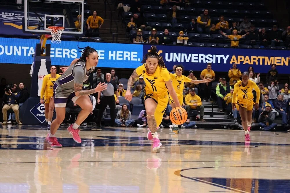 Senior guard JJ Quinerly steals the ball from a Kansas State University player at the WVU Coliseum on Feb. 17, 2025